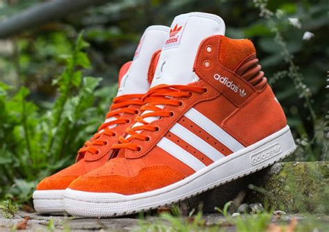 orange adidas sneakers|adidas high top orange.